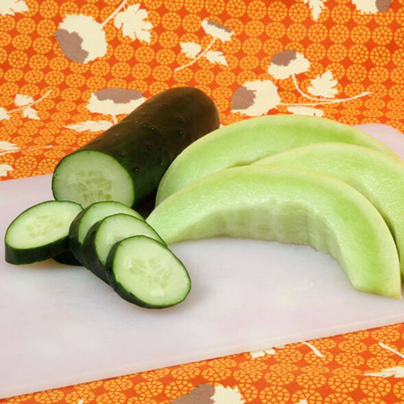 Cut cucumber and melon on a cutting board