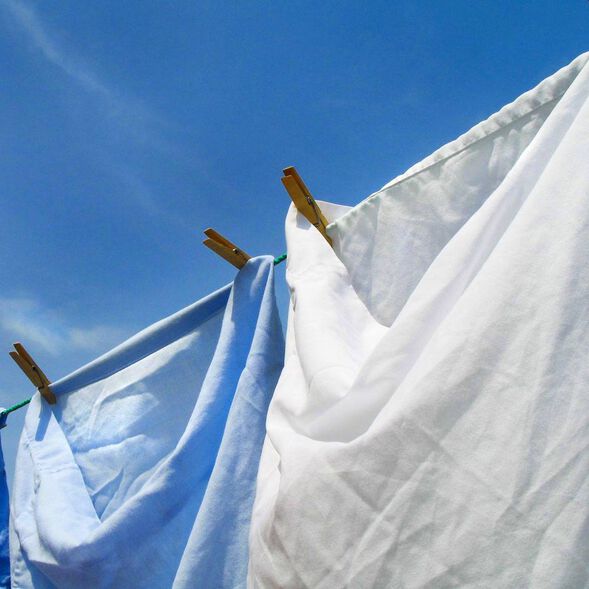Cotton sheets handing on a clothes line