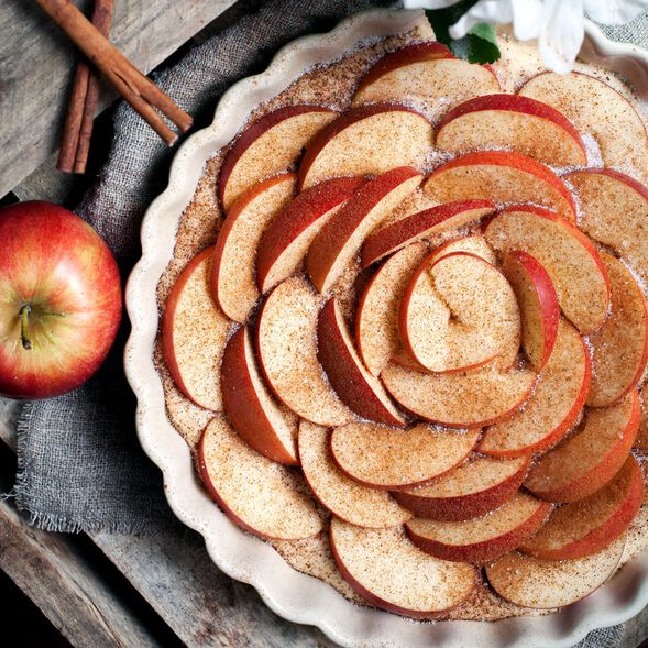 Slices of apples with cinnamon and vanilla on top
