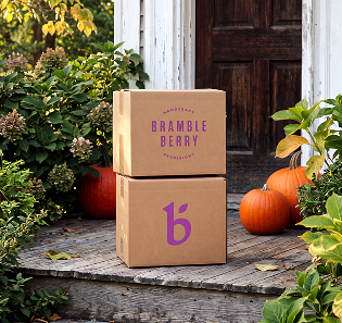 bramble berry boxes on a front step with flowers and pumpkins