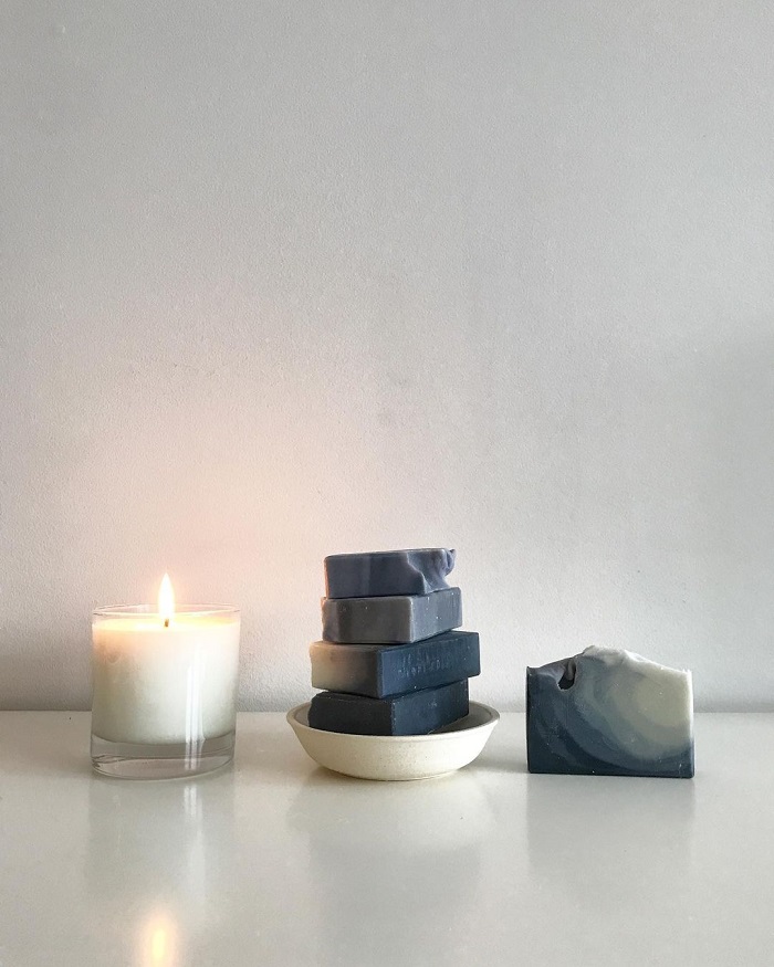 Dear Botanicals soap stacked next to a burning candle Dear
Botanicals soap stacked next to a burning candle