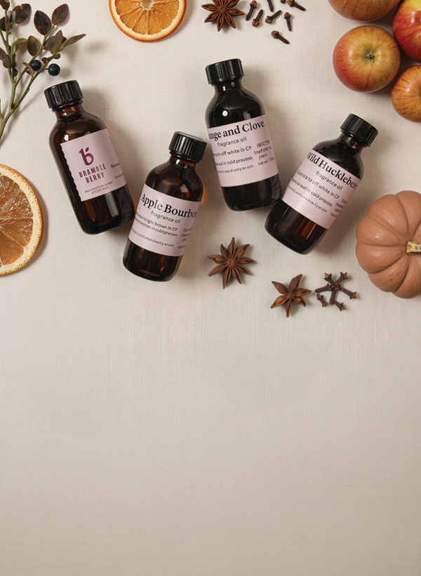 fragrance bottles with fall themed foods and flowers