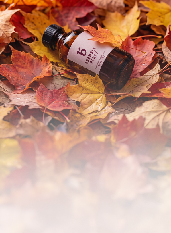 fragrance bottle on a pile of leaves