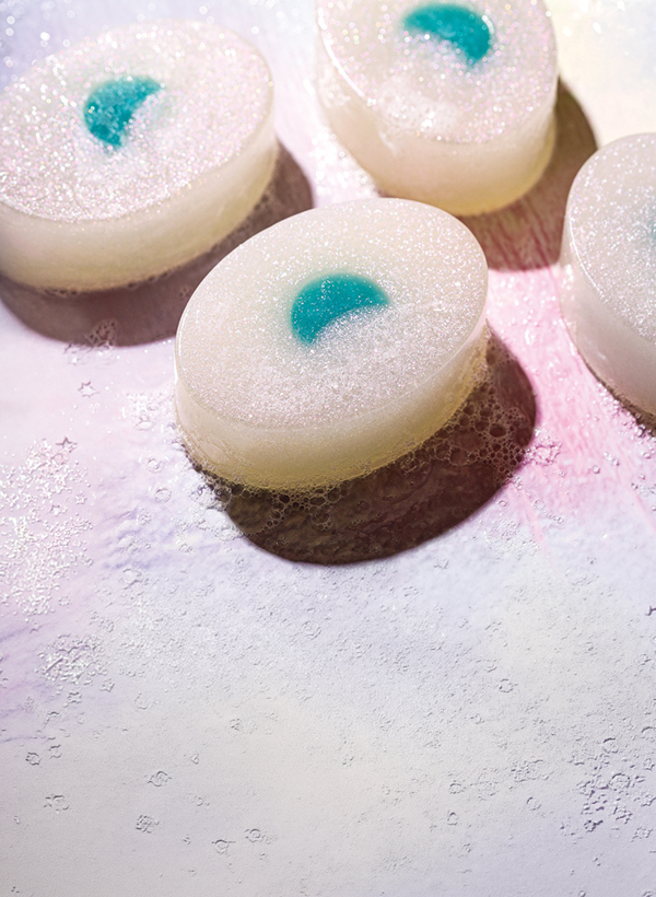 sparkly white bars of melt and pour with turquoise moons embedded