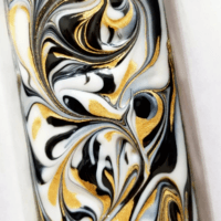 black, white, and gold swirled soap