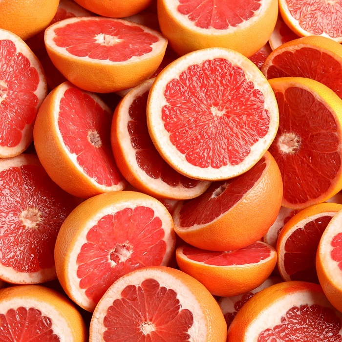 sliced pink grapefruits