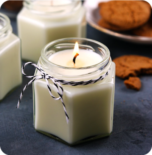 white candle with ginger cookies