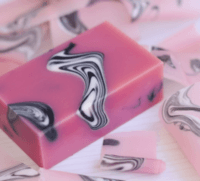 pink soaps with black and white