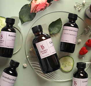 fragrance bottles with florals and green background 