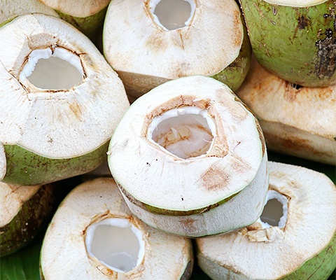 peeled hollowed out coconuts