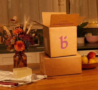 bramble berry boxes on a fall decorated countertop
