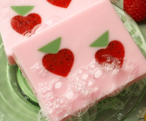 pink soap with strawberry embeds