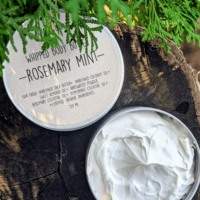 round containers of white body butter