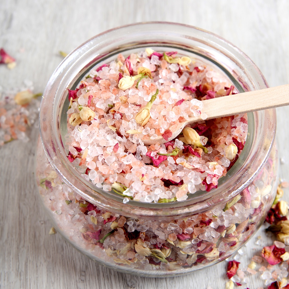 Rose bath salts A jar of pink bath salts with rose petals