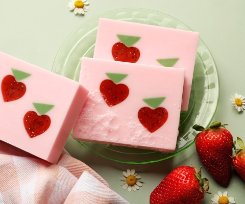 pink soap with strawberry embeds
