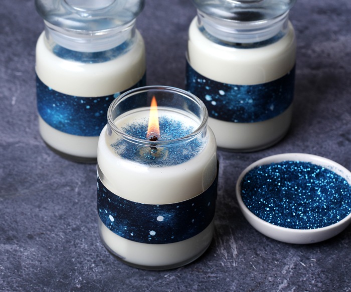 handmade candles with strips of blue wrapping paper | Bramble Berry